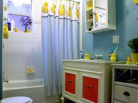 duck bathroom with red cabinets