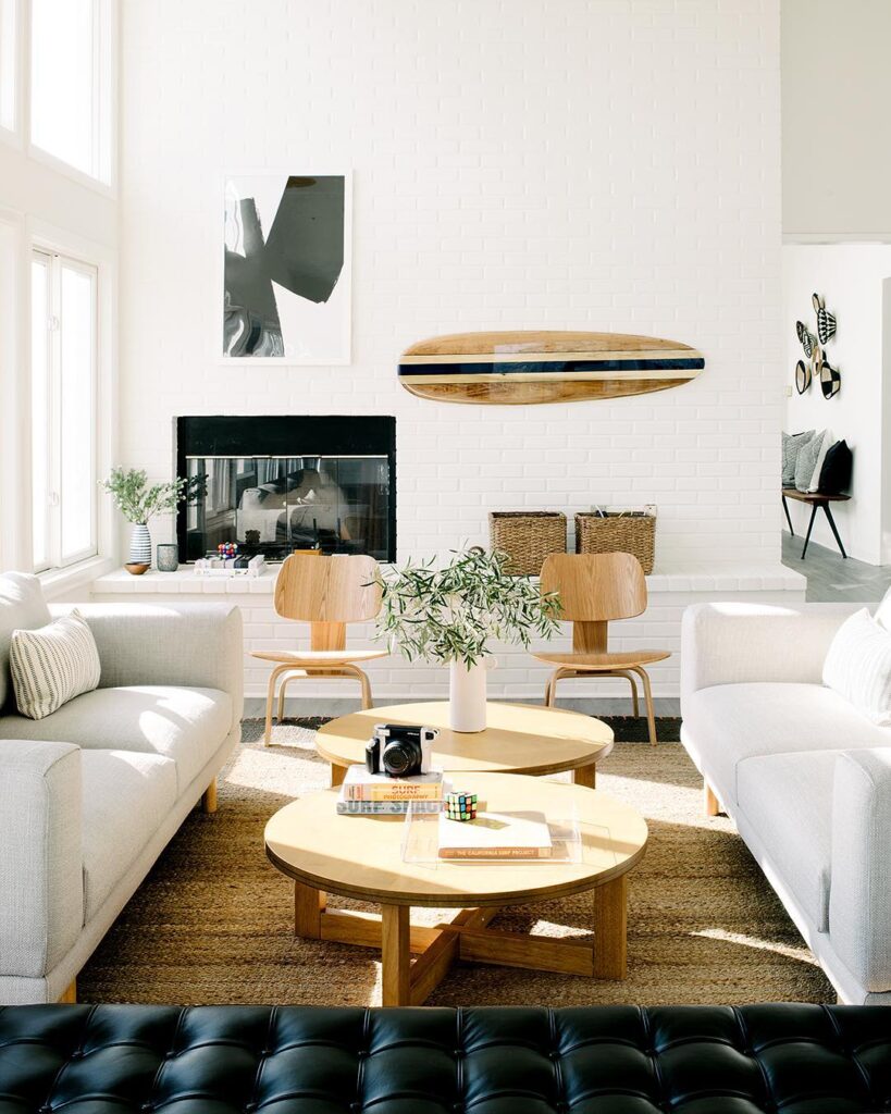 bright living room with surfboard